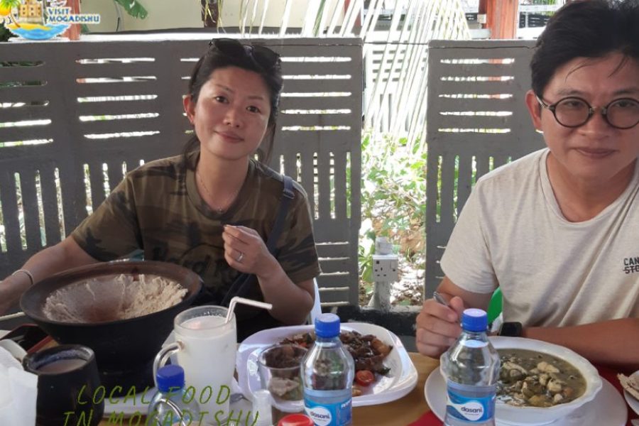 Tourist enjoying traditional Somali soor lunch